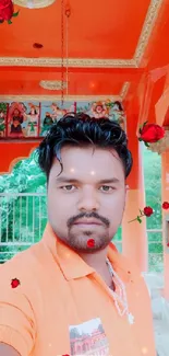 Man standing in an orange-themed temple with rose effects.