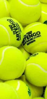 Close-up view of vibrant yellow tennis balls for wallpaper.