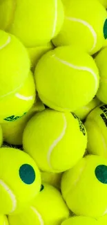 A vibrant collection of tennis balls creating a lively wallpaper background.