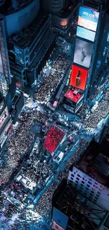 Times Square aerial view at night with vibrant lights and bustling crowds.