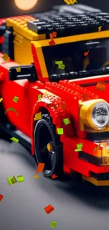 LEGO toy car in vivid red with yellow highlights on a mobile wallpaper.