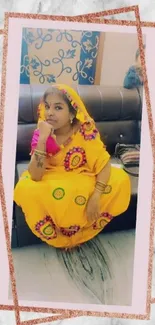 Vibrant traditional attire with yellow dress and artistic design on marble background.