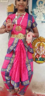 Girl in vibrant traditional dance attire against a cultural backdrop.