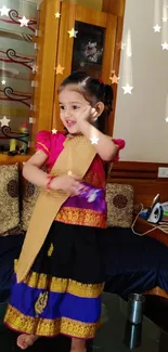 Child in traditional dress with colorful star design