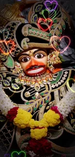 Intricate traditional mask with colorful designs on a black background.