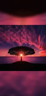 Vibrant sunset with a tree silhouetted against ocean waves.