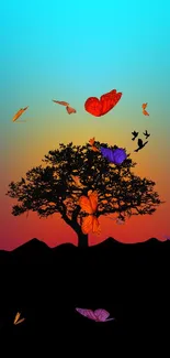 Silhouette tree with birds at vibrant sunset.