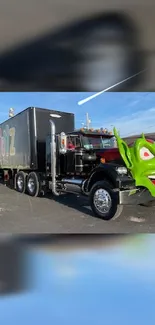 Mobile wallpaper of a black truck with a green goblin face on a sunny day.