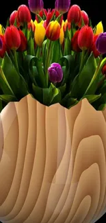 Vibrant tulips arranged in a smooth wooden vase on a black background.