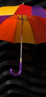 Colorful umbrella on black wavy background wallpaper.