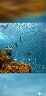 Colorful fish swimming in blue ocean with corals and sparkles.