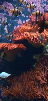 Underwater scene with clownfish and vibrant corals in vivid orange hues.