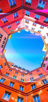 Vibrant orange and blue urban architecture wallpaper.