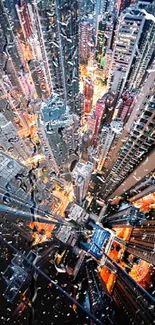 Dynamic aerial view of a vibrant and illuminated cityscape at night.