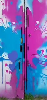 Colorful graffiti with pink and blue hearts on a mobile wallpaper.