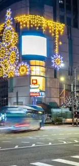 City street illuminated with vibrant holiday lights and decorations.