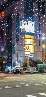 Vibrant city street at night with glowing lights and bustling urban life.