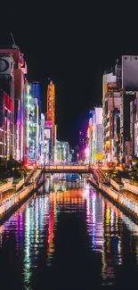 Vibrant city nightscape with neon reflections on a tranquil waterway.