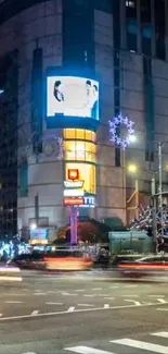 Vibrant city nightscape with bright lights and urban architecture.