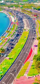 Coastal highway with vibrant skyline and greenery, perfect mobile wallpaper.