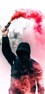 Hooded figure with red smoke bomb in urban setting.