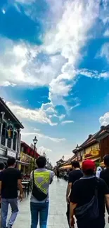 Group walking in vibrant urban street under a blue sky.