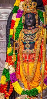 Colorful Vithoba statue with intricate garlands and traditional attire.