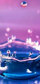 Vibrant pink and blue water splash wallpaper.