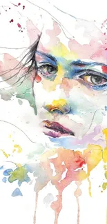 Artistic watercolor face with vibrant splashes on mobile wallpaper.