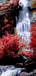 Waterfall with vibrant red autumn foliage in stunning mobile wallpaper.