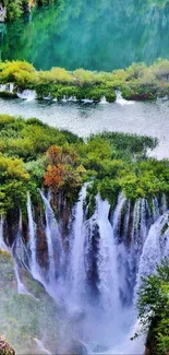 Scenic waterfall with lush green foliage and tranquil water view.