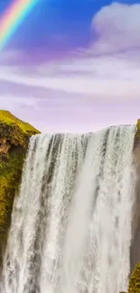 Waterfall with a rainbow in a vibrant nature scene.