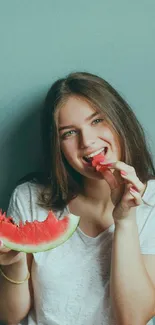 Girl enjoying watermelon against blue background, perfect for summer wallpaper.