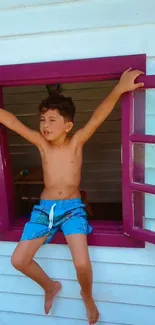 Child relaxing in a vibrant, colorful window frame.