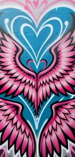 Vibrant pink and blue graffiti with winged heart design.