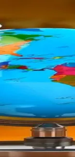 Colorful world map globe illustration on orange background.
