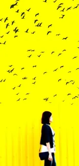 Yellow wallpaper with birds and a walking person.