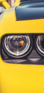 Yellow car with eye-catching headlights close-up view.