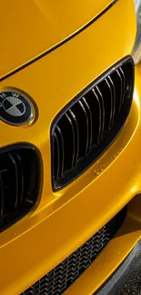 Vibrant yellow luxury car front display.