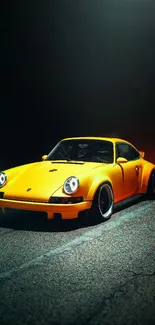 Vibrant yellow sports car on a dimly lit road wallpaper.