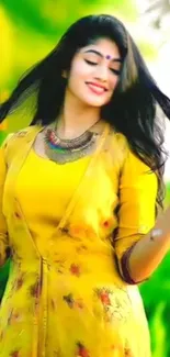 Woman in vibrant yellow attire surrounded by nature.