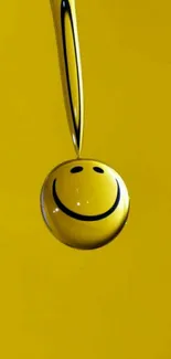 Vibrant yellow wallpaper with a smiling droplet design.