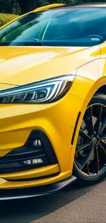 Yellow sports car with sleek design parked on road.