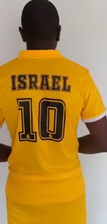 Yellow sports jersey with number 10 displayed on back view.