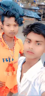 Colorful group selfie of three youths outdoors.