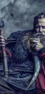 Viking warrior holding an axe and drinking horn.