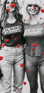 Two friends wearing matching vintage shirts in a black and white photo.