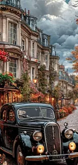 Vintage car on cobblestone street with autumn foliage and historic buildings.