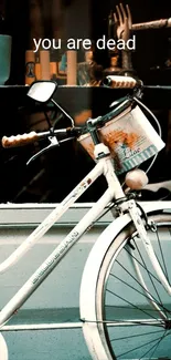 Vintage bike with teal tones and quote.