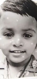 Vintage black and white portrait of a child with sparkling effect.